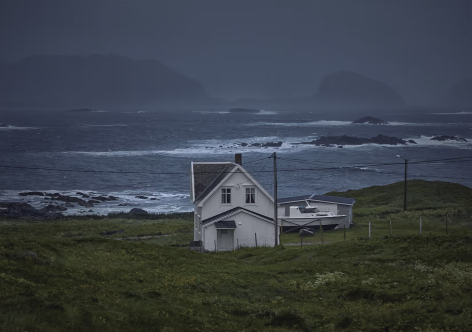 unedited photo of a house on the stormy coast of iceland