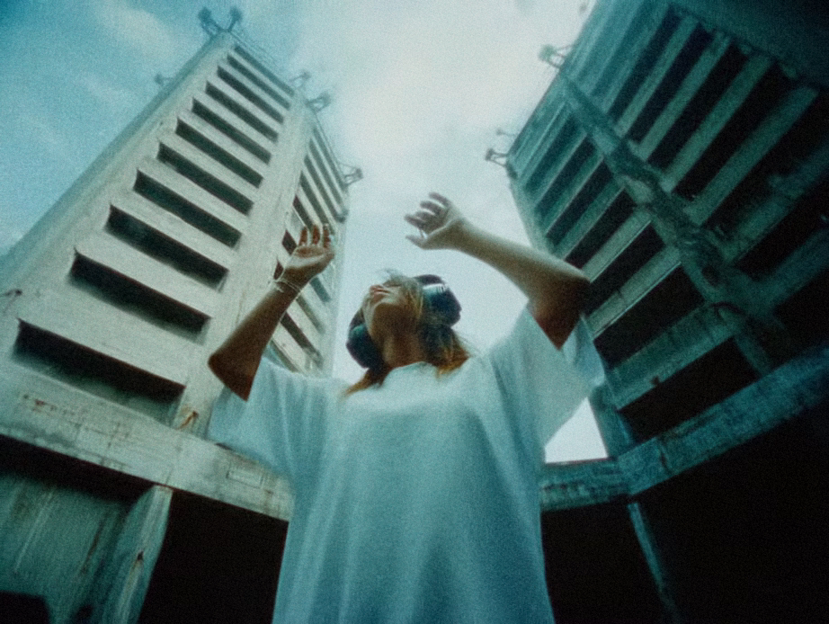 Music video color grading example - Cinematic low-angle shot with blue shadows and blown-out highlights, graded with Color.io for a lo-fi analog feel.