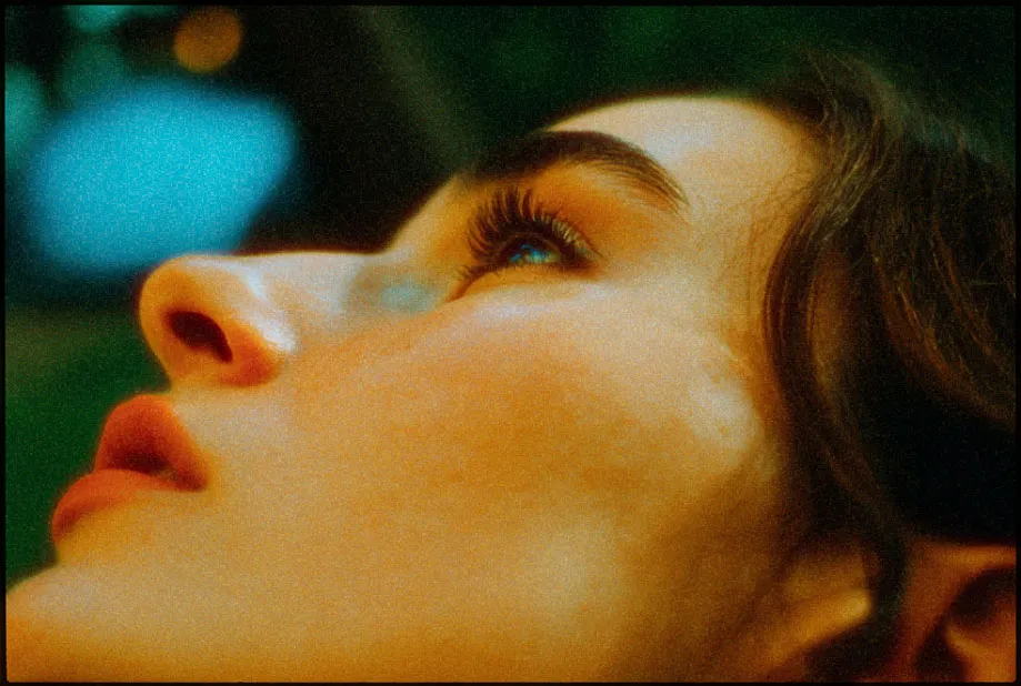 Cinematic portrait of a young woman. Film emulation, dutch angle, film grain and realistic halation. Shot by Steve Tanaka